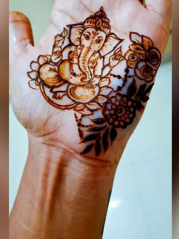 Create beautiful mehndi designs on your hands to welcome Bappa